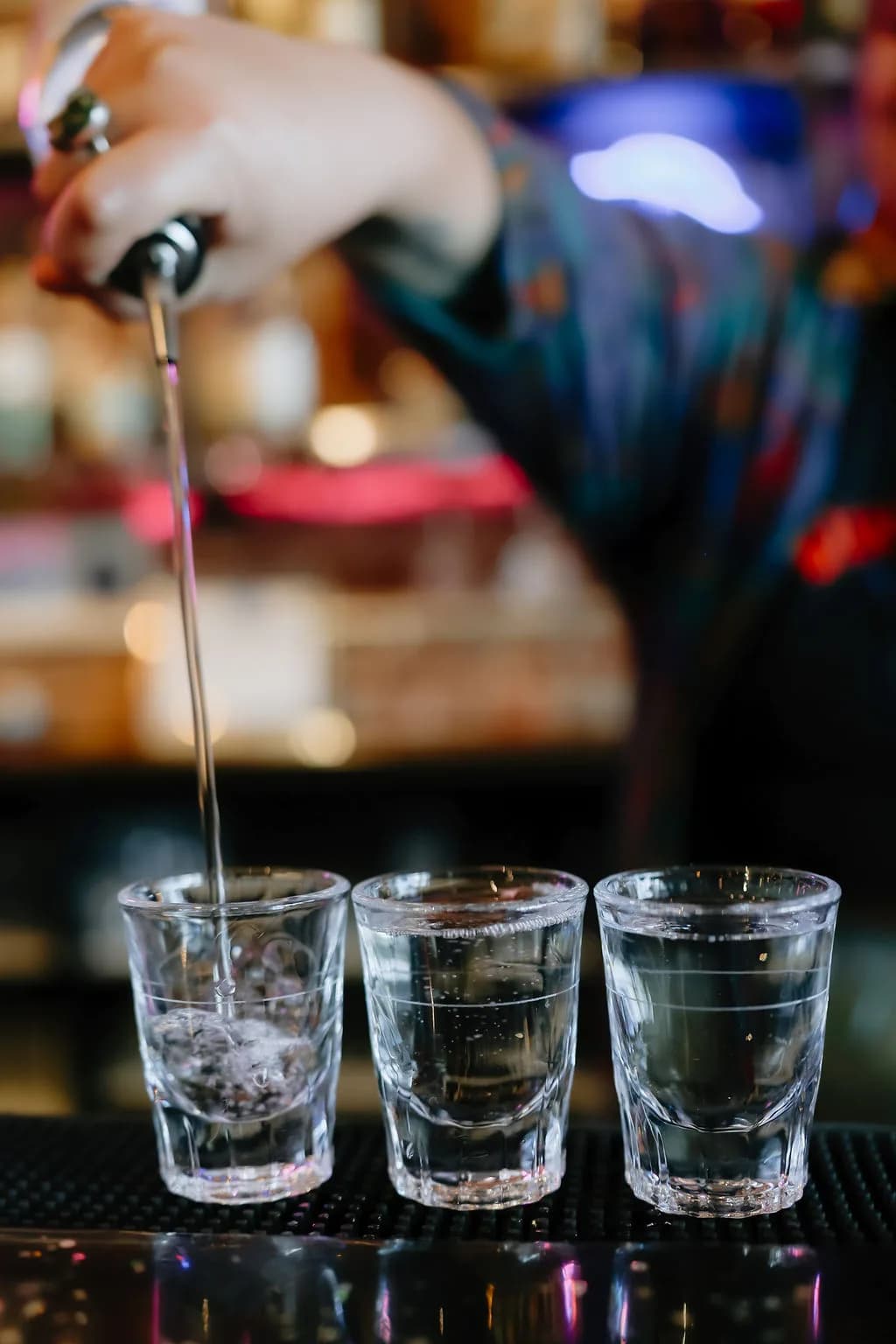 pouring-row-of-shot-glasses-bartop.jpg